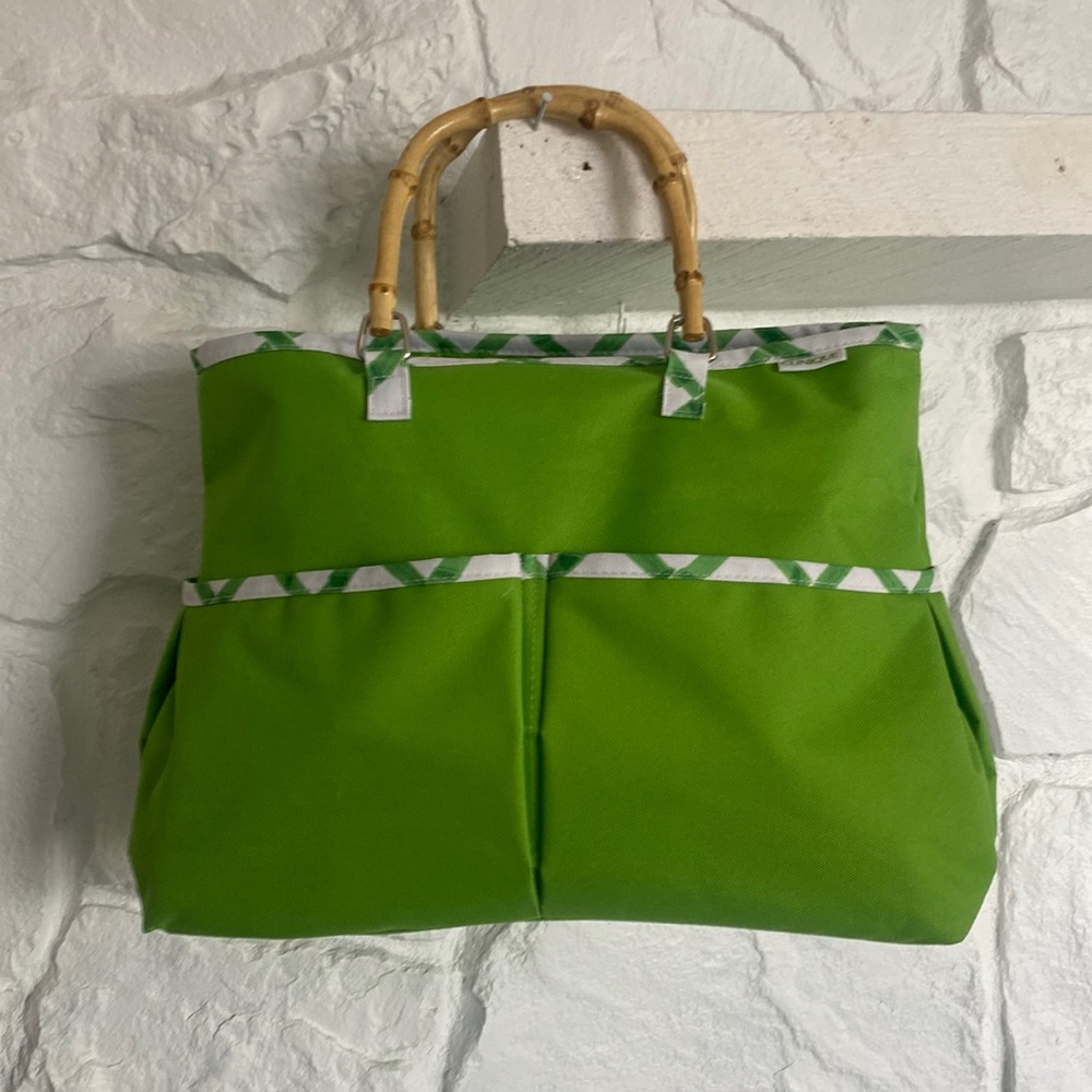Clinique Bag bright green with bamboo like handles and front pockets